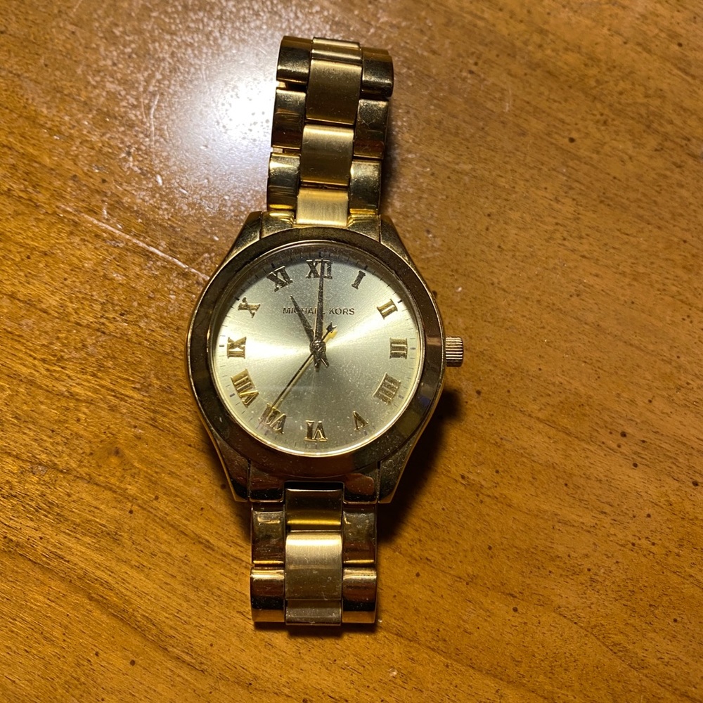 Women’s gold Michael Kors watch
